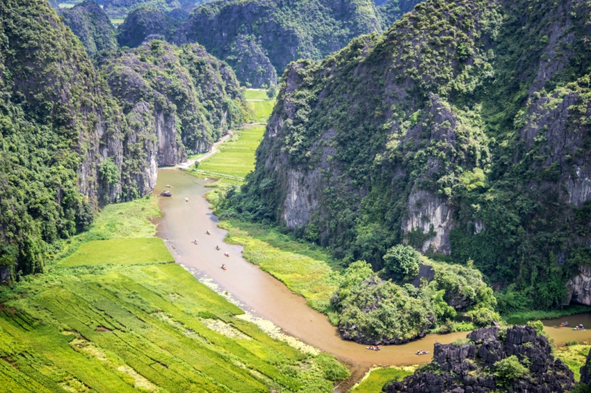 Aerial view of the river among rice fields and limestone mountains, vietnamese scenic landscape at ninh Binh, Vietnam